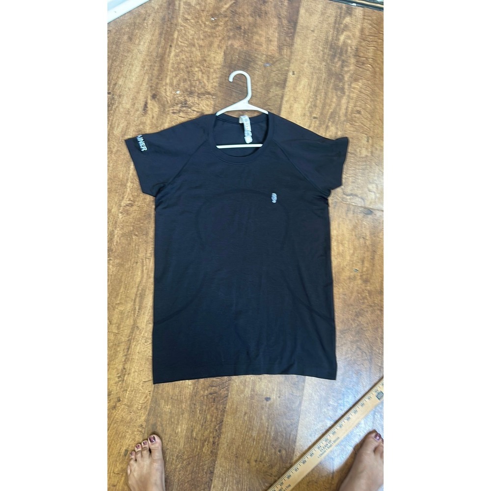 Black‎ Lululemon shirt with seahorse and "trainer" embroidery hit. Item 468